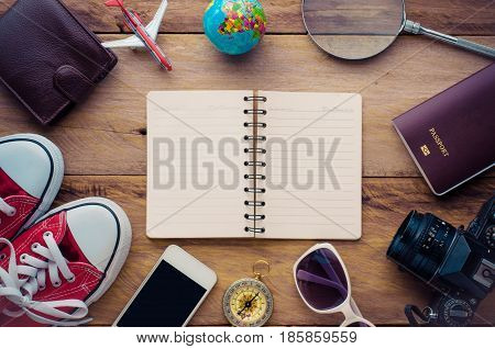 Planning for trip clothing and accessories on wood floo