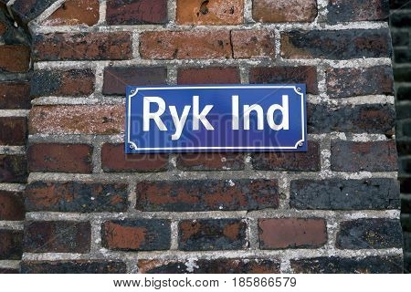 Ryk Ind street sign in Ribe Denmark. In English: Move In.