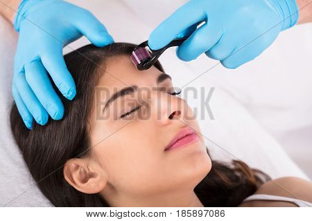 Woman Having Facial Treatment On Her Face In Beauty Salon