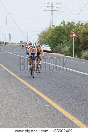 Nahariyya Israel - May 06 2017 : Participants of the annual triathlon competes in cycling on the route in Ahziv near Nahariyya Israel