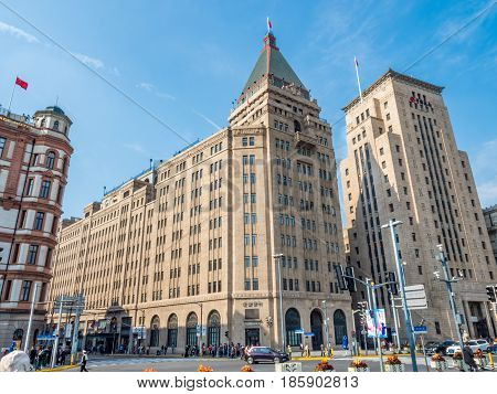 Shanghai, China - Nov 4, 2016: View of Former Palace (South Wing of the Peace) Hotel, Sassoon House and Bank of China buildings (left to right) along The Bund on Zhongshan East 1st Road.
