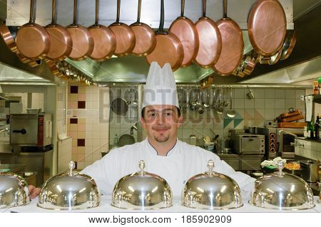 Cook On The Kitchen Of A Hotel At Leukerbad