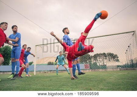 Young player kicking the ball