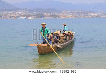HIROSHIMA JAPAN - MARCH 19, 2017: Unidentified people take a Itsukushima shrine cruise boat in Miyajima. Miyajima is famous for Itsukushima shrine.