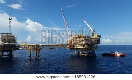 Supply boat transfer cargo to oil and gas industry and moving cargo from the boat to the platform