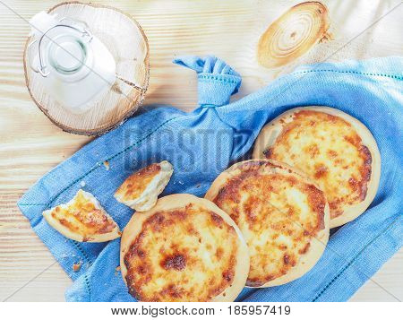 Traditional russian pasties Shanga - opened circle pie with cottage cheese. Carols cheesecake with cottage cheese. Top view or flat lay