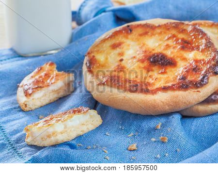 Traditional russian pasties Shanga - opened circle pie with cottage cheese. Close up view of carols cheesecake with cottage cheese.