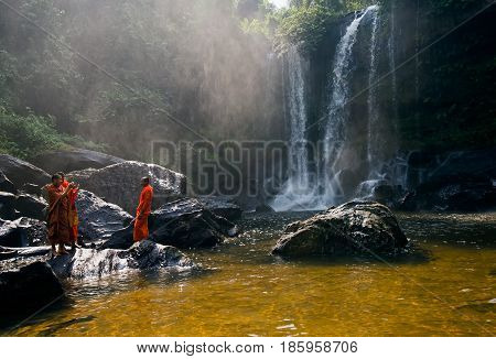 SIEM REAP, CAMBODIA - JANUARY 27, 2015: Unidentified group of monk in Phnom Kulen waterfall in Kulen National Park, Siem Reap Province, Cambodia.