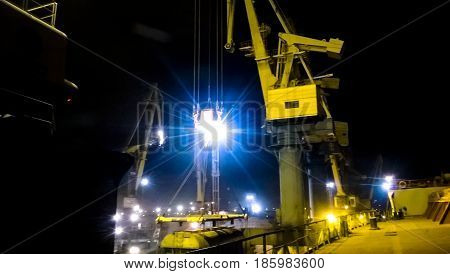 Industrial Seaport At Night. The Rotation Of The Car With Grain