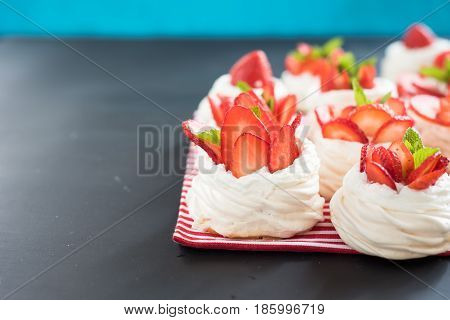 meringue nests with strawberry cream, fresh strawberries