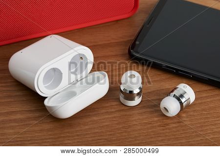 Wireless Cordless Bluetooth Earbuds And Chargeable Case With Smartphone And Partable Speaker
