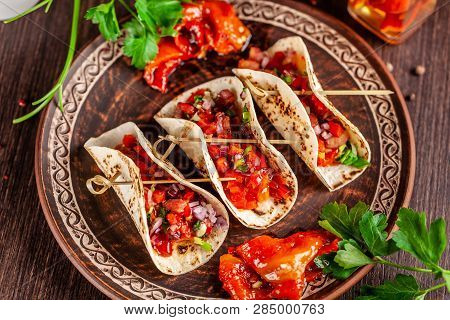 Concept Of Mexican Cuisine. Mexican Appetizer Tacos With Vegetables, Beans, Paprika, Chilli Peppers