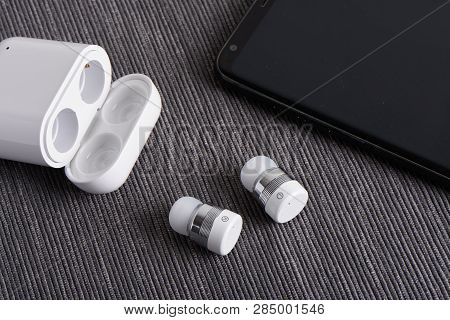 Wireless Cordless Bluetooth Earbuds With Chargeable Case And Smartphone