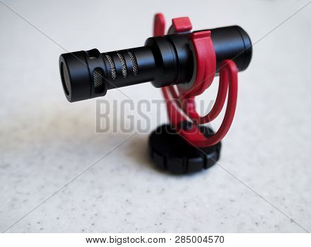 Professional Cardioid Directional Condenser Video Microphone On Table