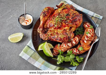 Roasted Chicken Smothered With Tomato Sauce And Whole Grain Mustard Served With Hasselback Sweet Pot