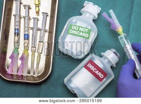 Nurse Preparing Parenteral Medication Discard And Not Discard, Syringes With Medication On Tray, Con