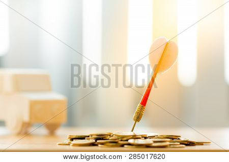 Red Arrow Embroidery On The Coin And Car Background Put On The Desk In The Office, Targeting Of Busi