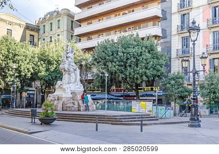 Barcelona, Spain - November 10, 2018:  Theater Square On The Rambla And The Monument To The Founder 