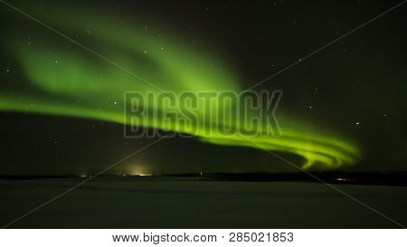 Northern Light (aurora Borealis) In The Horizon Above Ivalo From Saariselka In Finnish Lapland.