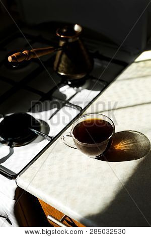 Black Coffee On The Breakfast In The Morning. Glass Cup And Sunny Weather.