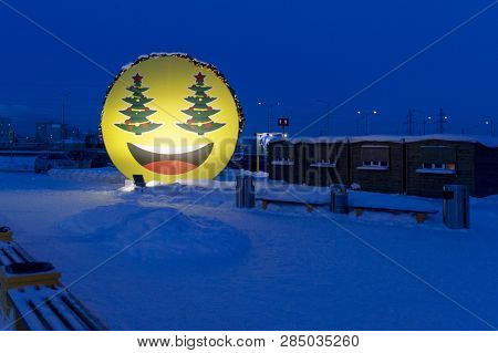 Big Poster Smiley Withc Hristmas Tree Eyesat The Supermarket Parking In The Evening, Surgut, Russia 