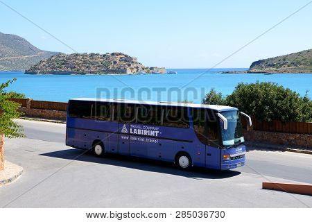 Crete, Greece - May 15: The Bus For Tourists Transportation Is Near Entrance To Hotel And View On Sp