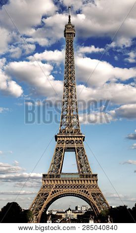 Majestic Eiffel Tower Symbol Of The City Of Paris With Hdr Effect And The White Clouds In The Blue S