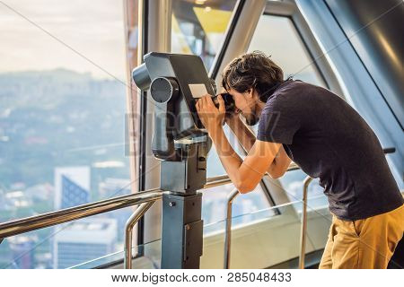Man Looks At Kuala Lumpur Cityscape. Panoramic View Of Kuala Lumpur City Skyline Evening At Sunset S