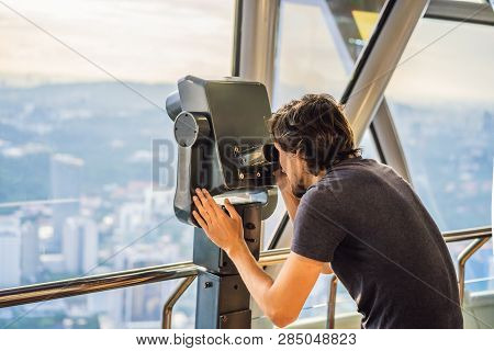 Man Looks At Kuala Lumpur Cityscape. Panoramic View Of Kuala Lumpur City Skyline Evening At Sunset S