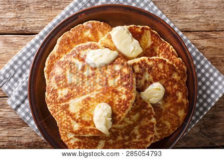 Delicious Grilled Pancakes With Butter Close-up On A Plate. Horizontal Top View