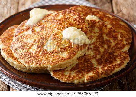 Delicious Grilled Pancakes With Butter Close-up On A Plate. Horizontal