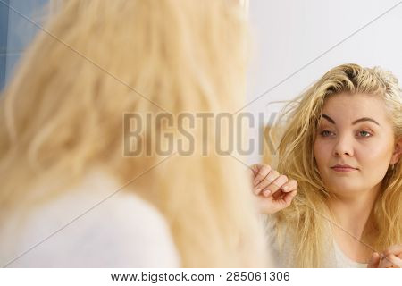 Young Blonde Female Feeling Dull And Tired After Waking Up. Woman Yawning Being Sleepy In Bathroom.