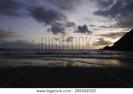 Beautiful Summer Golden Sunset Above The Black Sea.with Calm Waves And Reflection Of Sun On The Beac