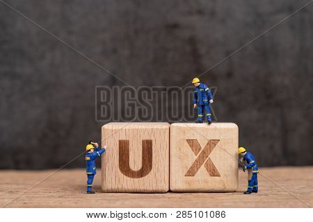 User Experience Design In Product And Service Concept, Miniature People Workers With Blue Team Unifo