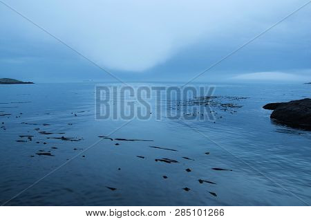 Glowing Patches Of Fog Over Juan De Fuca Strait Seen From Mcneill Bay, Victoria, British Columbia.