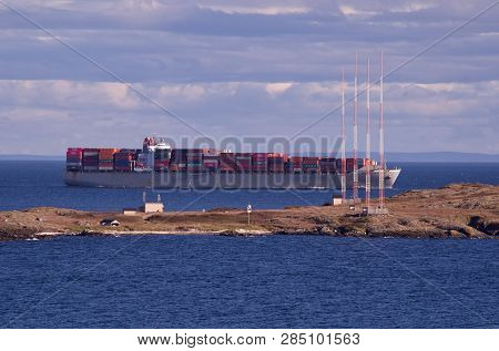 Juan De Fuca Strait, British Columbia, September 16, 2018: Fully Loaded Container Ship Passes Close 