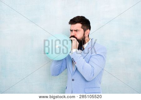 Man Inflating A Blue Balloon. Bearded Man With Balloon. Happy Birthday. Preparation To Party, Celebr