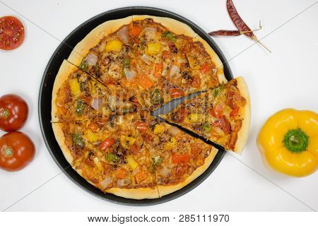 Pizza With Sauce, Bellpepper, Seasoning, Tomato In White Background