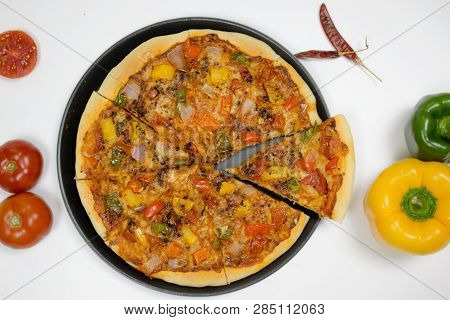 Pizza With Sauce, Bellpepper, Seasoning, Tomato In White Background