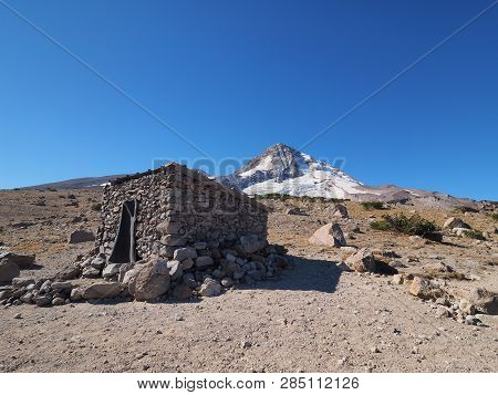 The Cooper Spur Shelter On The Timberline Trail With Mount Hood And The Eliot Glacier In The Backgro