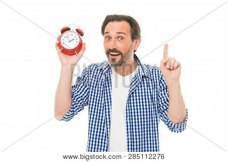 Keeping Track Of Time. Mature Timekeeper With Analog Clock Pointing Finger Up. Mature Man Holding Al