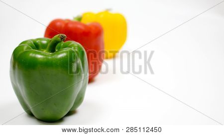 Bell pepper or capsicum in white background, yellow, red, green bell pepper.
