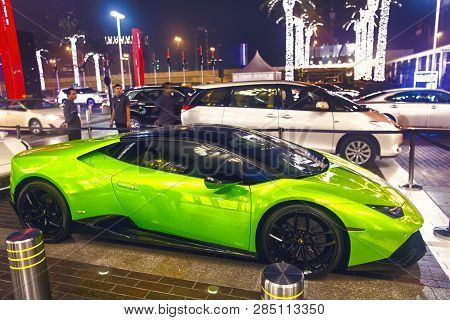 Dubai, Uae - December 23, 2017: Luxury Supercar Lamborghini Huricane Greeen Color Parked Next To Dub