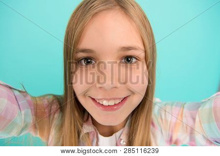 Let Me Take Selfie. Child Girl Hold Smartphone Takes Photo. Child Kid Happy Face. Video Call Concept