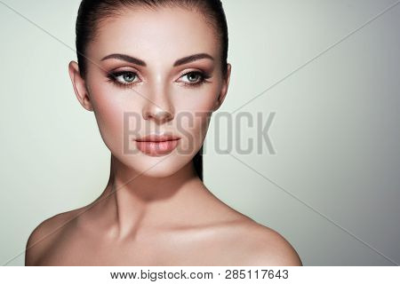 Beautiful Young Woman With Clean Fresh Skin. Perfect Makeup. Beauty Fashion. Eyelashes. Cosmetic Eye