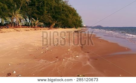 Ocean Sandy Beach Heaped With Garbage. Ecological Concept. Ecological Catastrophy.