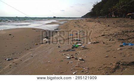 Ocean Sandy Beach Heaped With Garbage. Ecological Concept. Ecological Catastrophy.