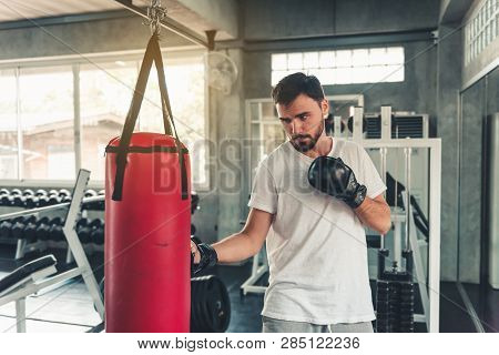 Sporty Boxer Is Exercise Punching In Fitness Gym.,portrait Of Boxing Man Is Practicing Footwork In S