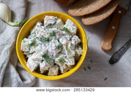 Traditional Cold Potato Salad With Onions And Herbs On A Linen Tablecloth Background. Rustic Style.