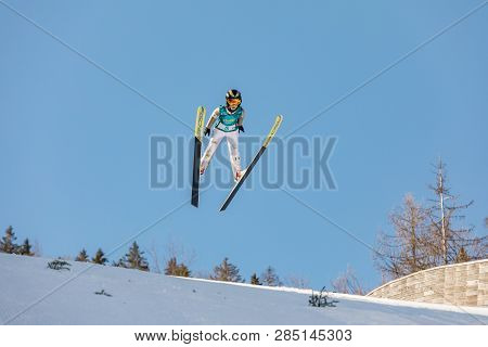 Planica, Slovenia - February 17, 2019. Young Jumpers Jump In Planica On A Beautiful Sunny Day. Plani